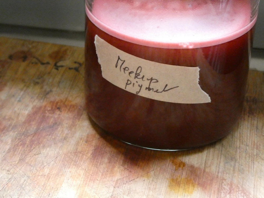 madder pigment in a glass bottle.